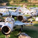Operace Blesk - People look at the wreckages of war planes, destroyed during an Israeli operation on the Entebbe international airport in 1976 to rescue hostages, at Aero beach, south of UgandaÕs capital Kampala