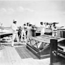 Gatling - The Voyage homeward from British New Guinea on board HMS Dart (on the Job). Gatling guns are seen mounted on the ship’s sides-1885 – wikimedia.commons –